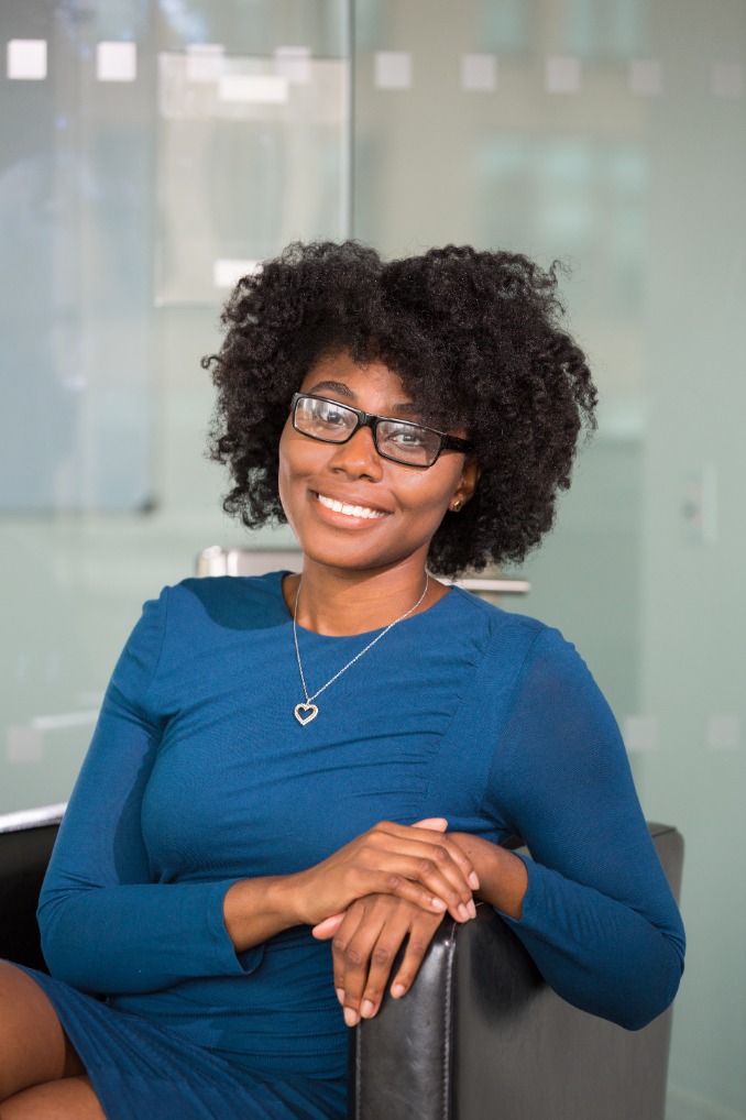 A lady sitting and smiling